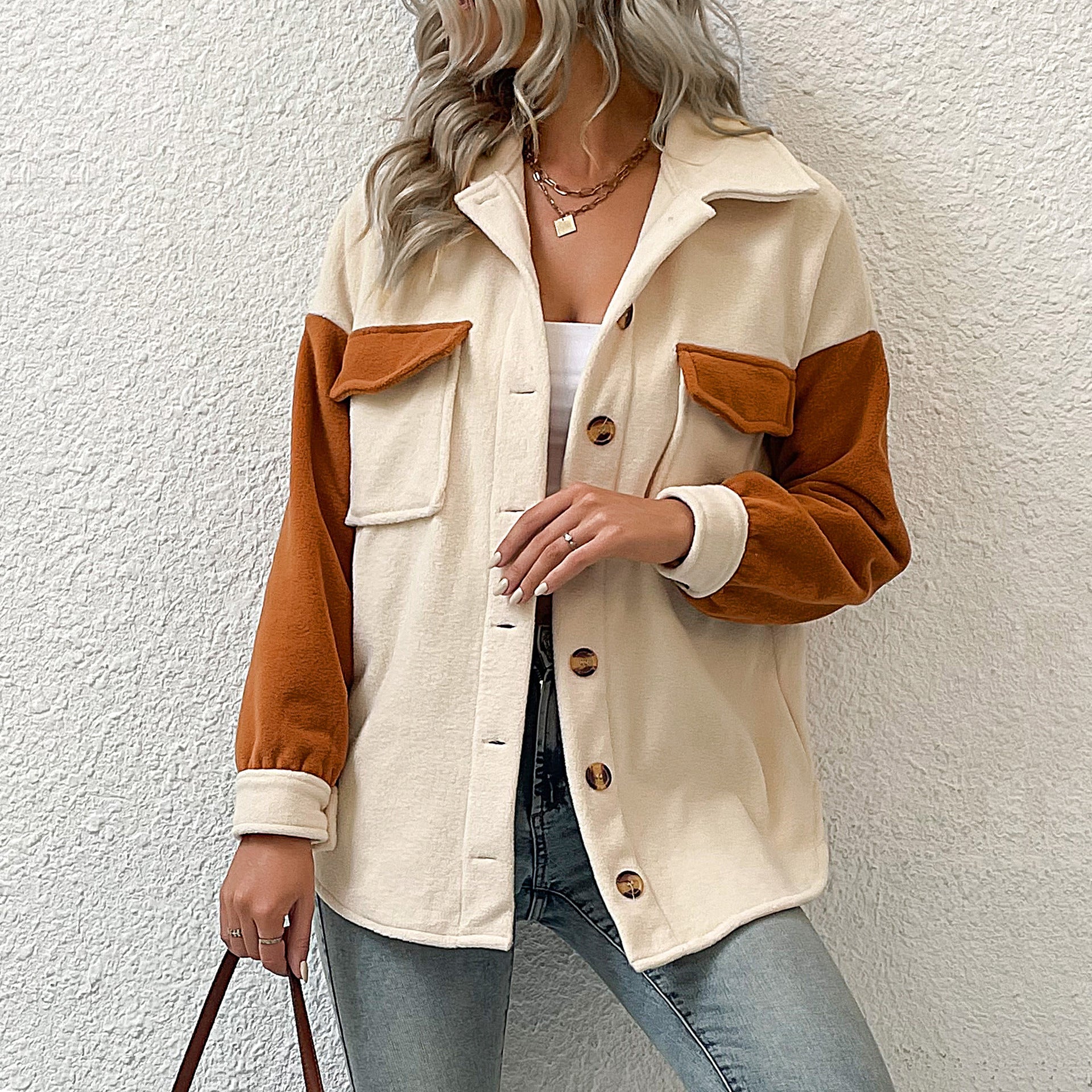 Ladies fashionable transitional jacket with pockets and contrasting sleeves