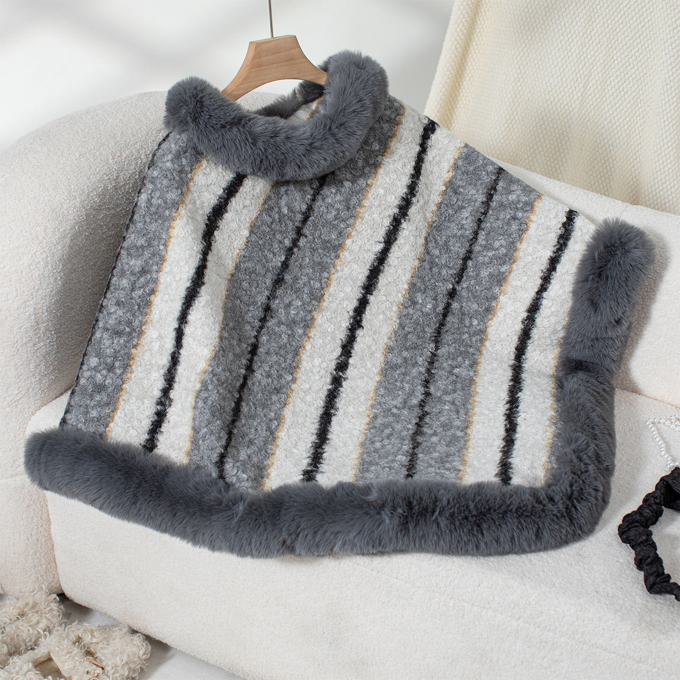 Ladies elegant poncho with luxurious fur trim