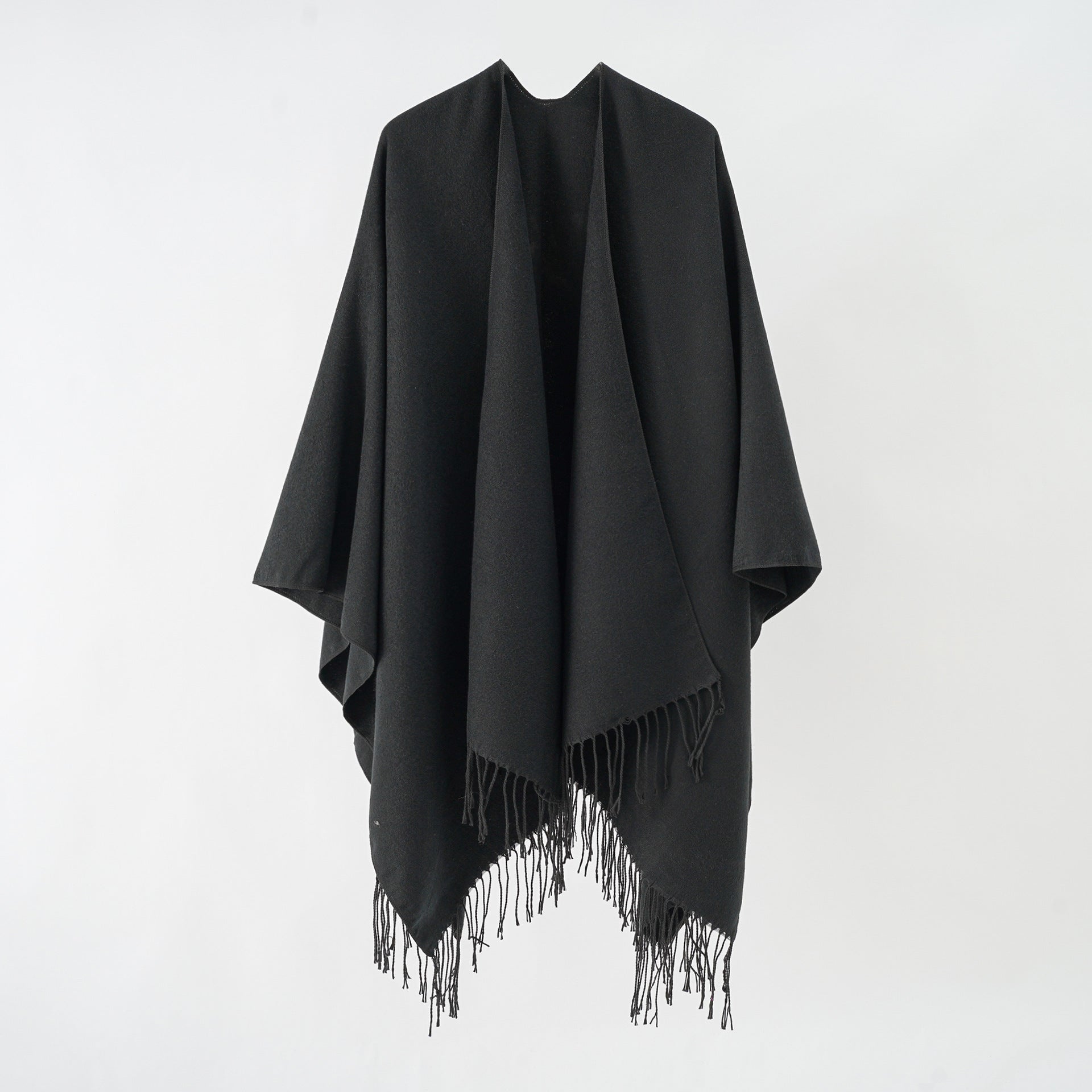 Women's stylish fringe poncho made from soft material with a luxurious drape