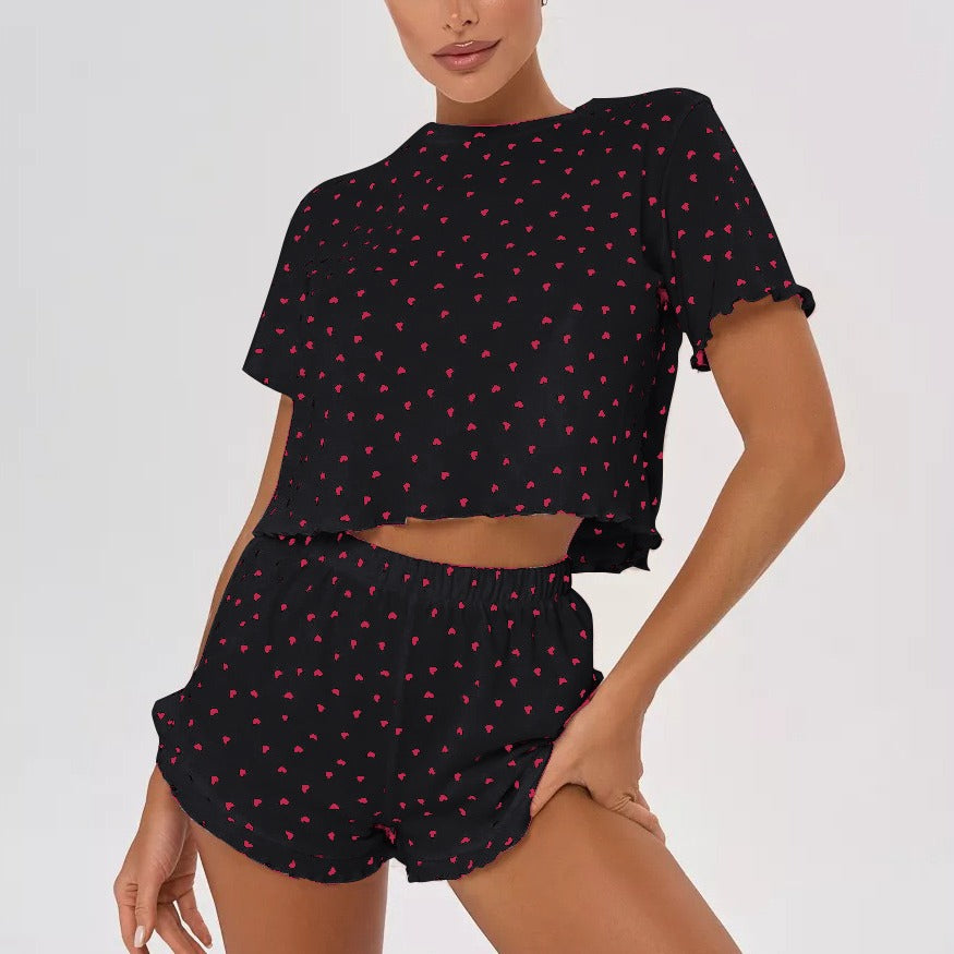Women's pajama set with cheerful heart design and playful hem