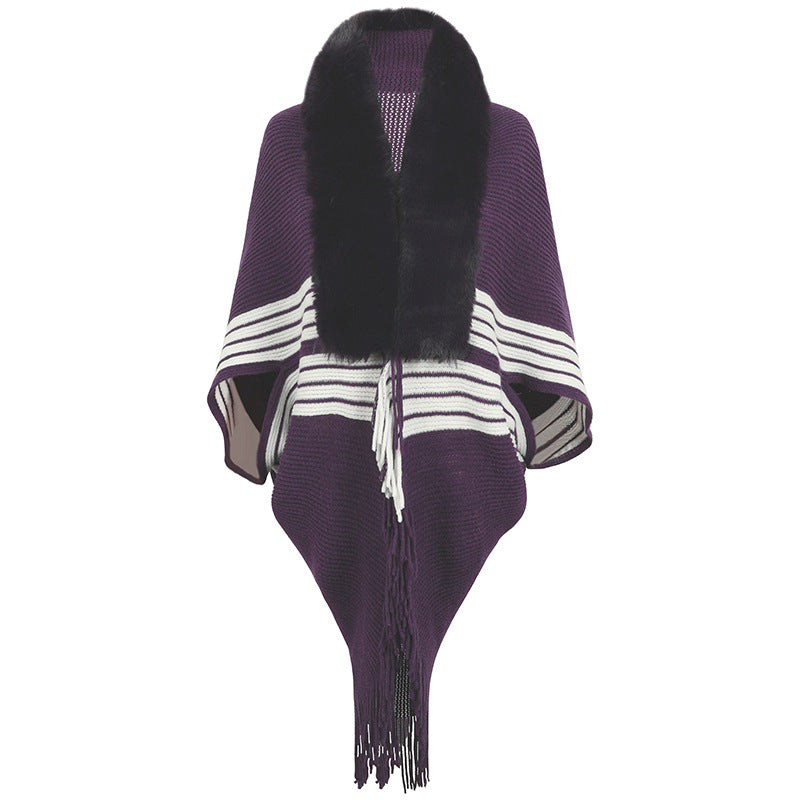 Women's elegant knitted poncho with faux fur trimmed collar and fringes