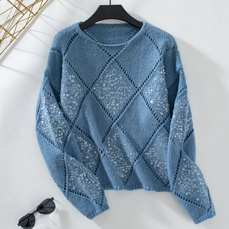 Ladies fashionable pullover with intricate knit design and glitter elements