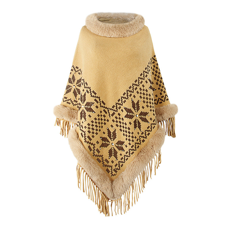 Ladies elegant poncho with decorative fringe design and faux fur trim
