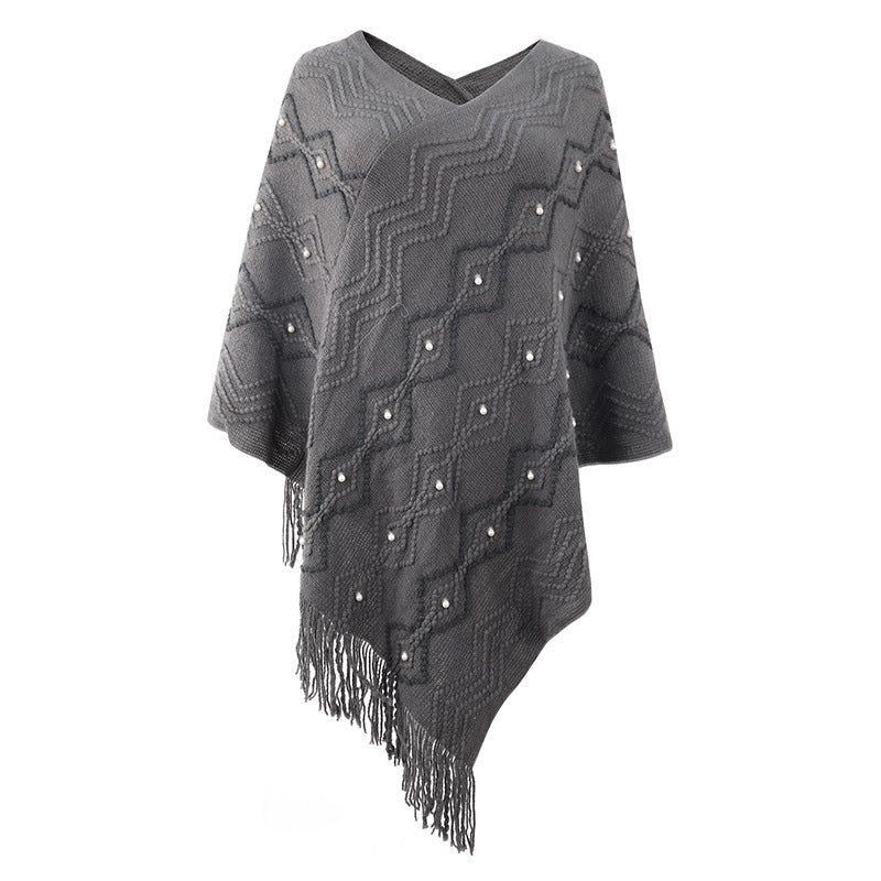 Ladies elegant poncho with eye-catching textured pattern and decorative fringes