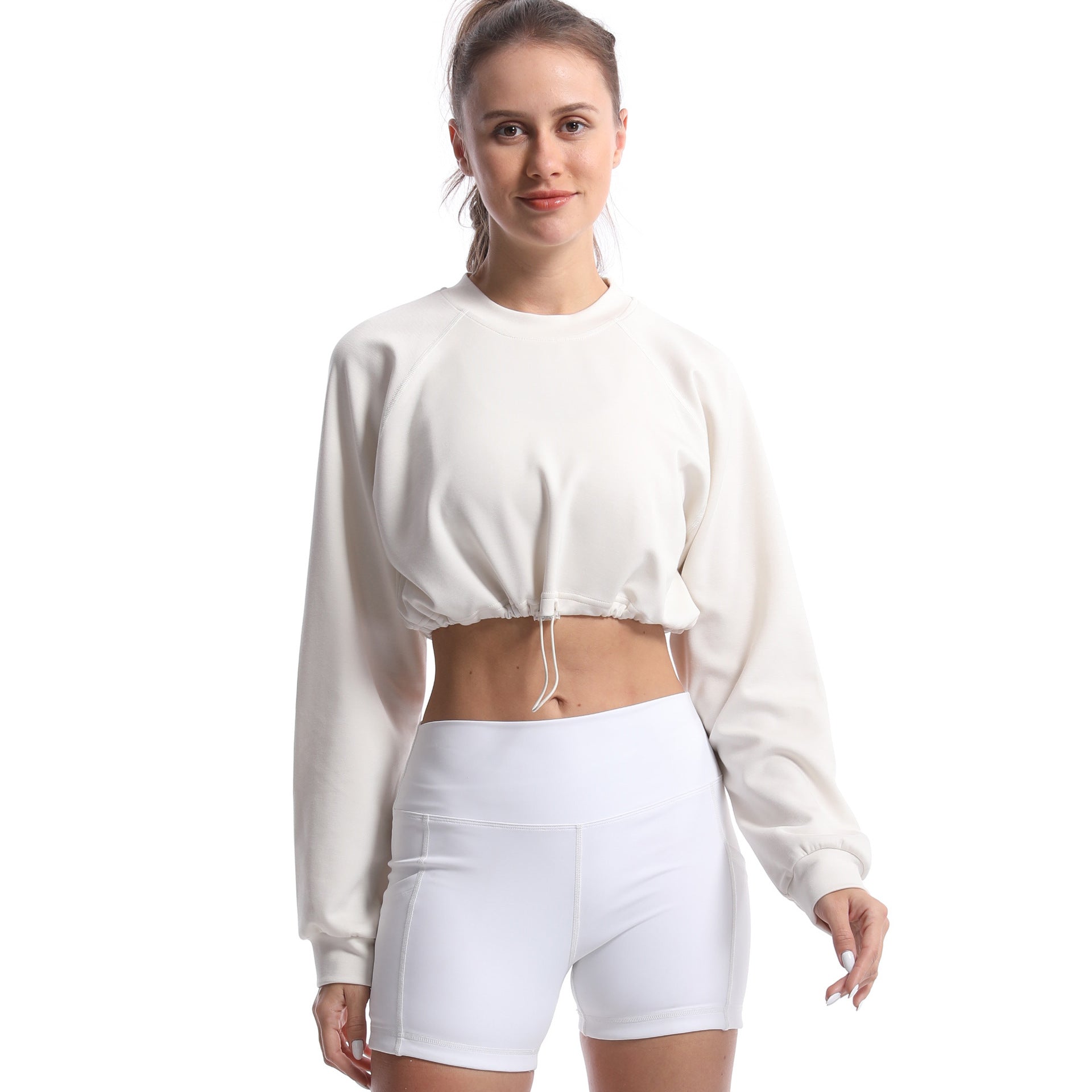 Women's sporty crop pullover with adjustable hem and long sleeves