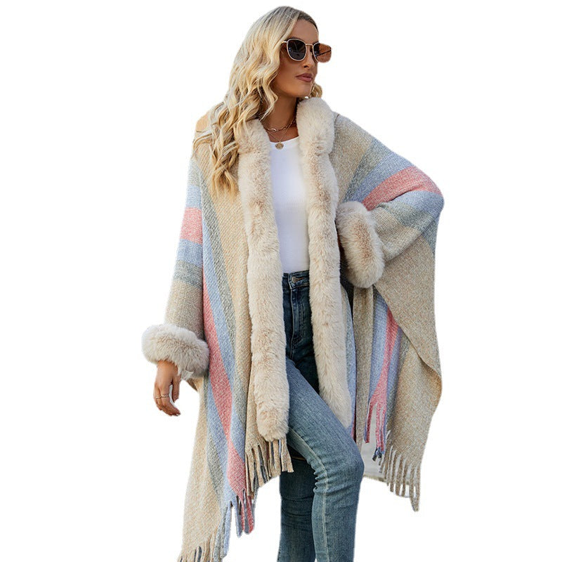 Ladies fashionable poncho with luxurious faux fur collar and fringes