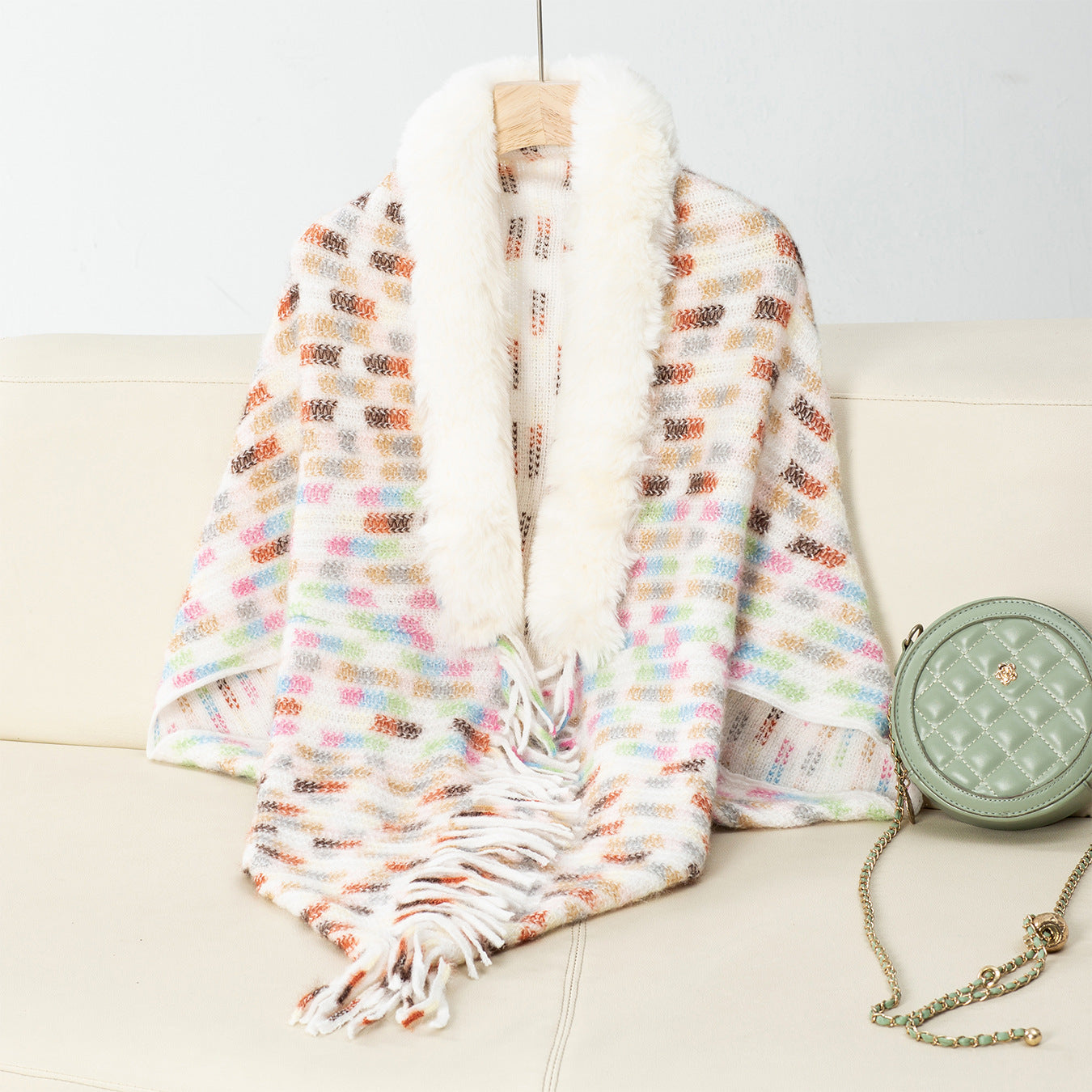 Ladies elegant poncho with luxurious faux fur collar and fringes
