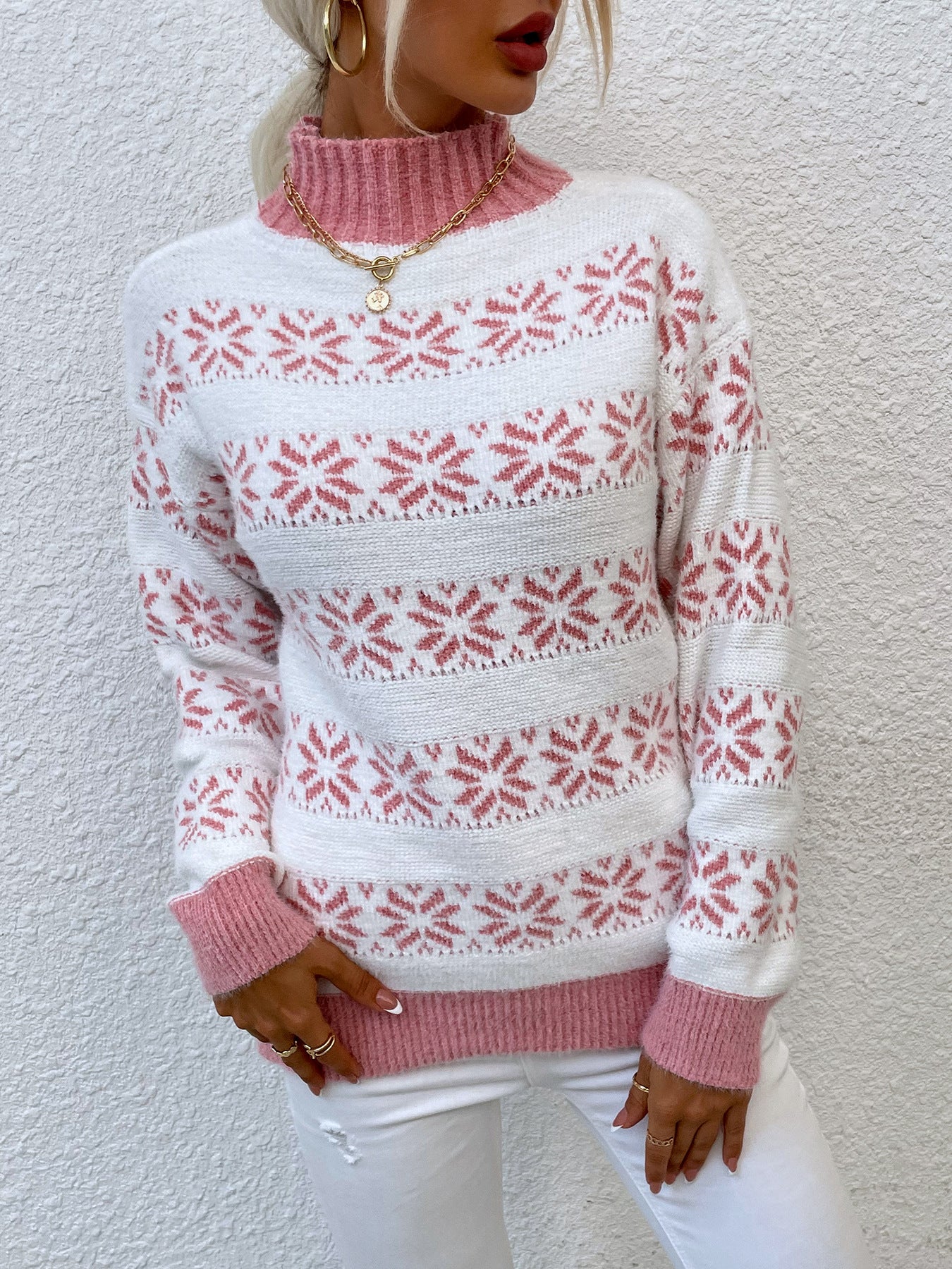 Women's knit pullover with winter motif and high neck collar