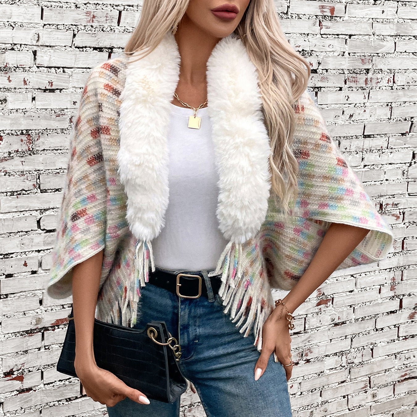 Ladies elegant poncho with luxurious faux fur collar and fringes