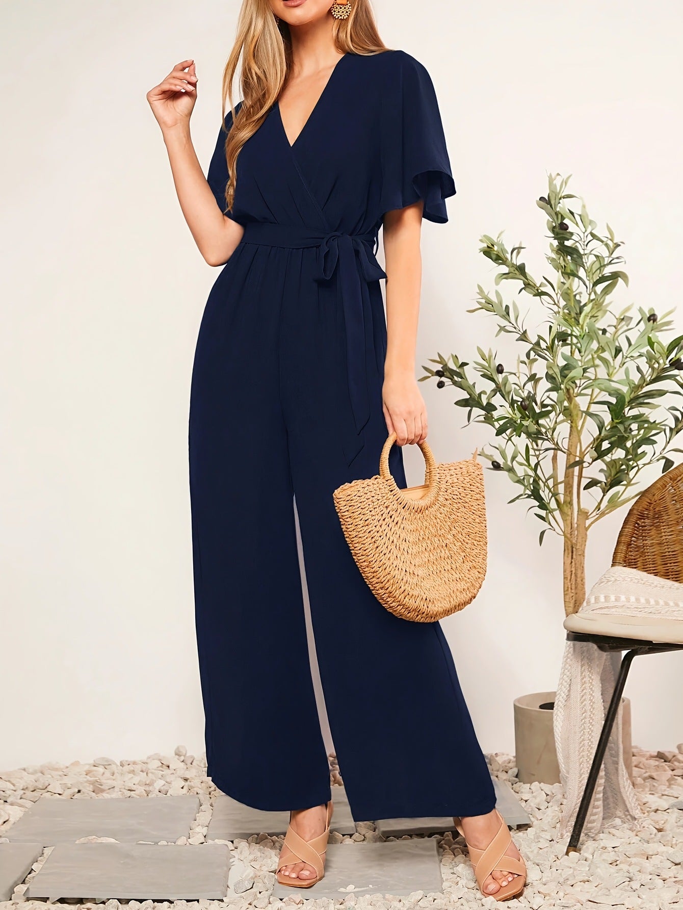 Ladies elegant jumpsuit with deep V-neck and poncho sleeves