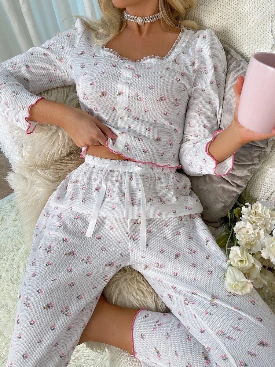 Women's pajama set with floral details and ruffle cutouts