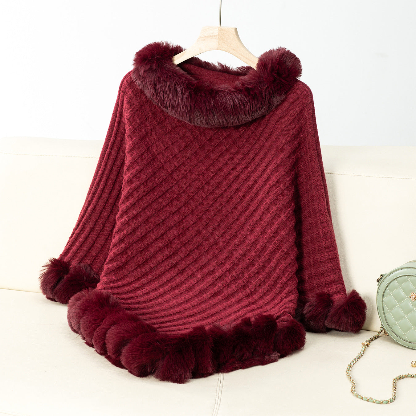Women's cozy knitted blanket with luxurious faux fur trim