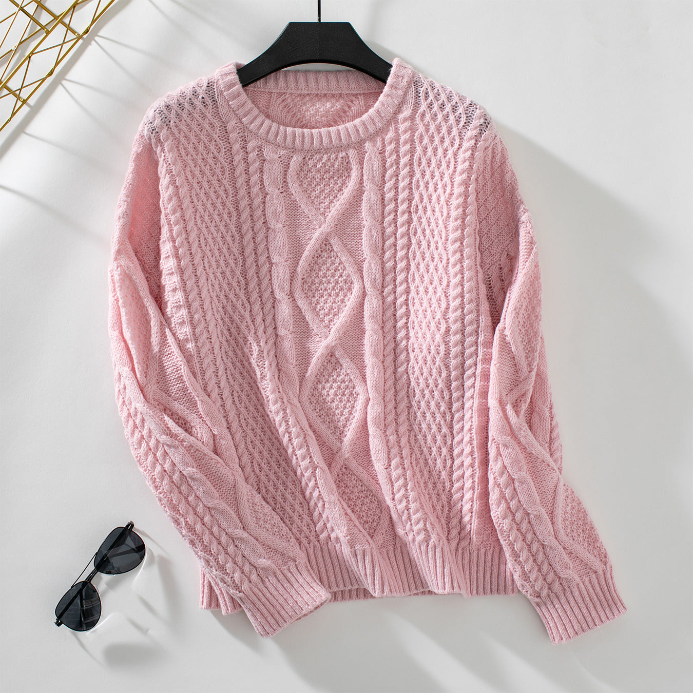 Women's knit pullover with textured cable design and round neck