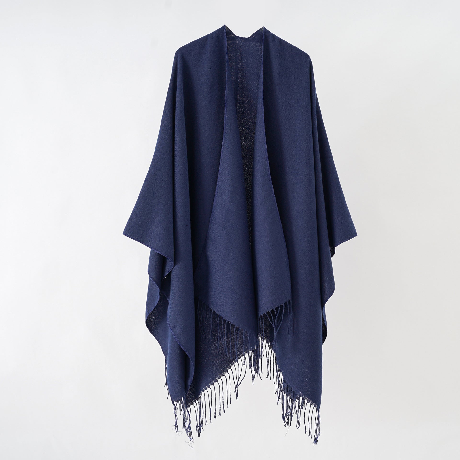 Women's stylish fringe poncho made from soft material with a luxurious drape