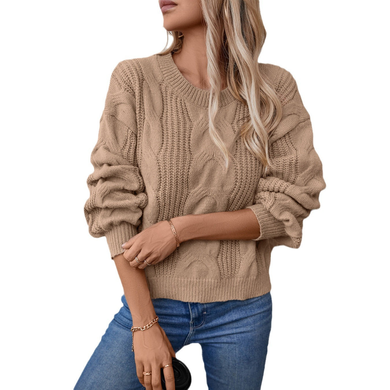 Women's chunky knit pullover with voluminous sleeves and cable pattern