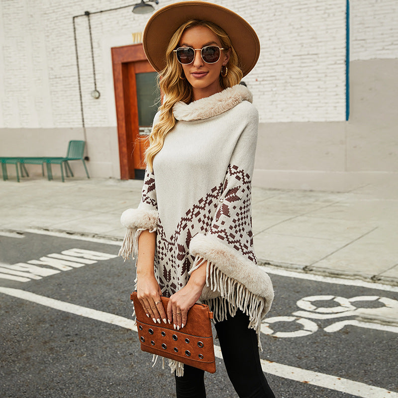 Ladies elegant poncho with decorative fringe design and faux fur trim