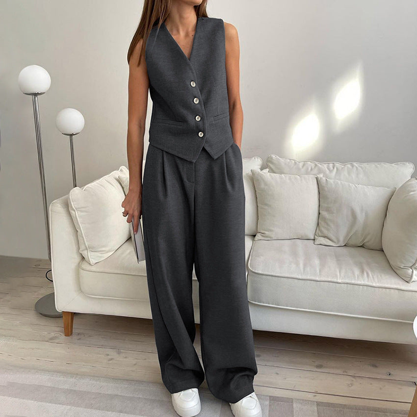 Ladies elegant fitted suit set with sleeveless blazer and wide pants