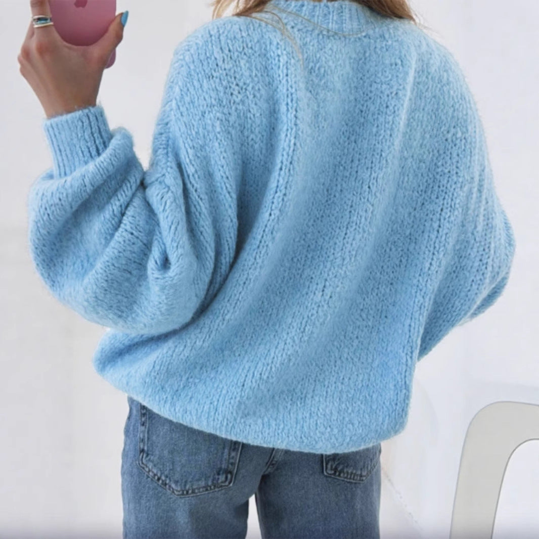 Women's cozy pullover with voluminous sleeves and textured design
