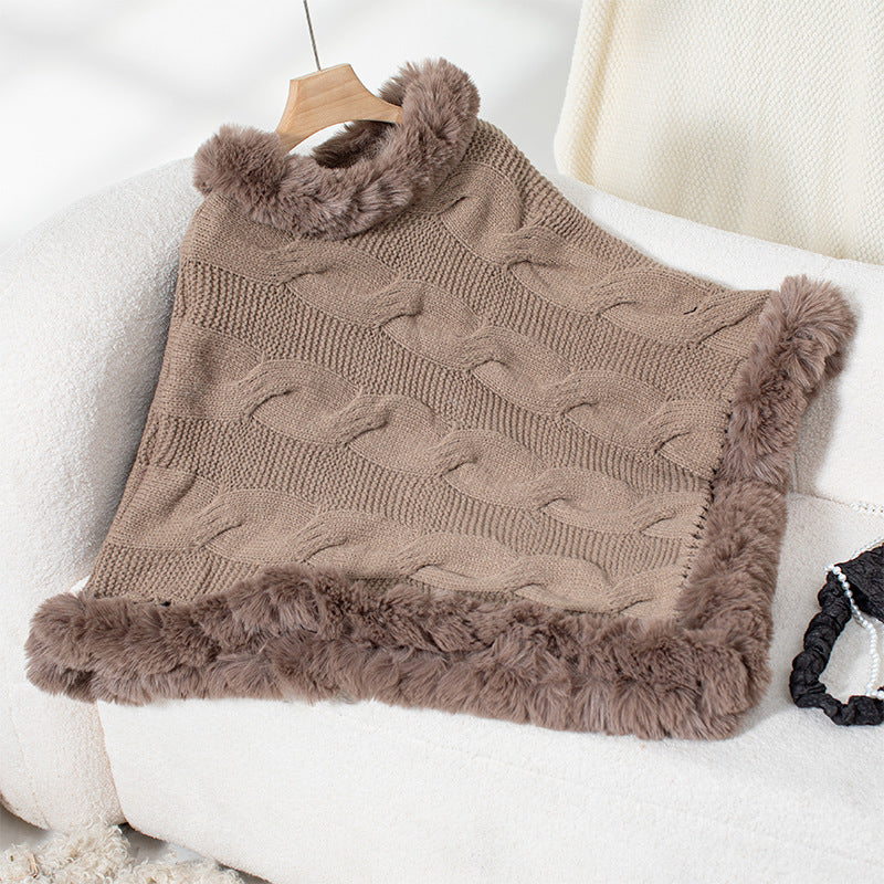 Women's cozy knit poncho with soft faux fur trim and cable knit pattern