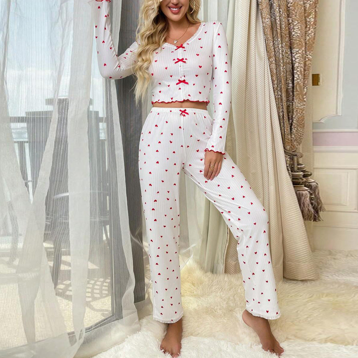 Women's pajama set with playful heart design and ruffle details