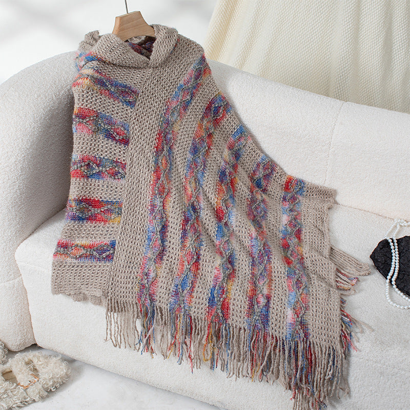 Ladies knit poncho with hood and fringed design