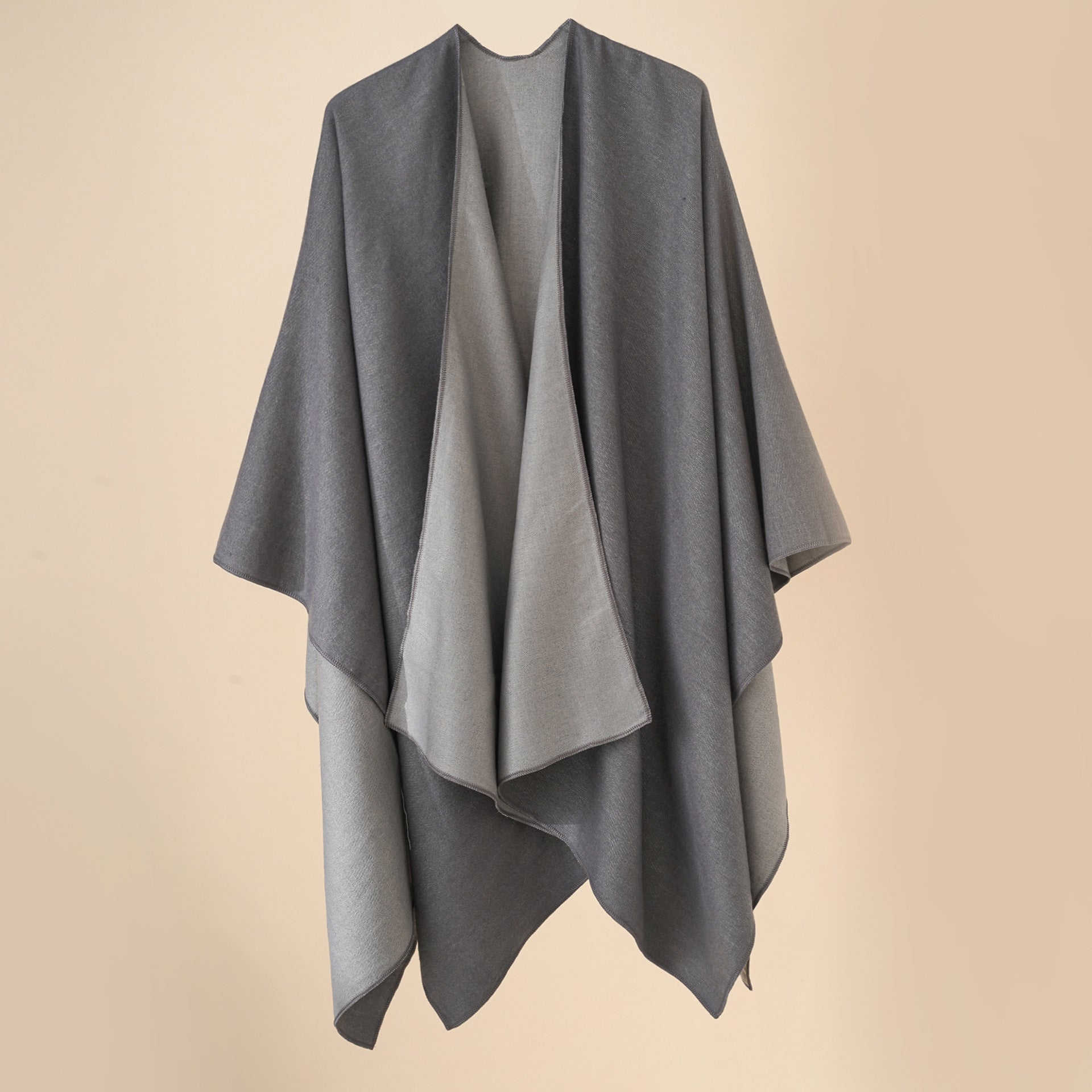 Women’s cozy poncho made of soft wool blend with elegant cut