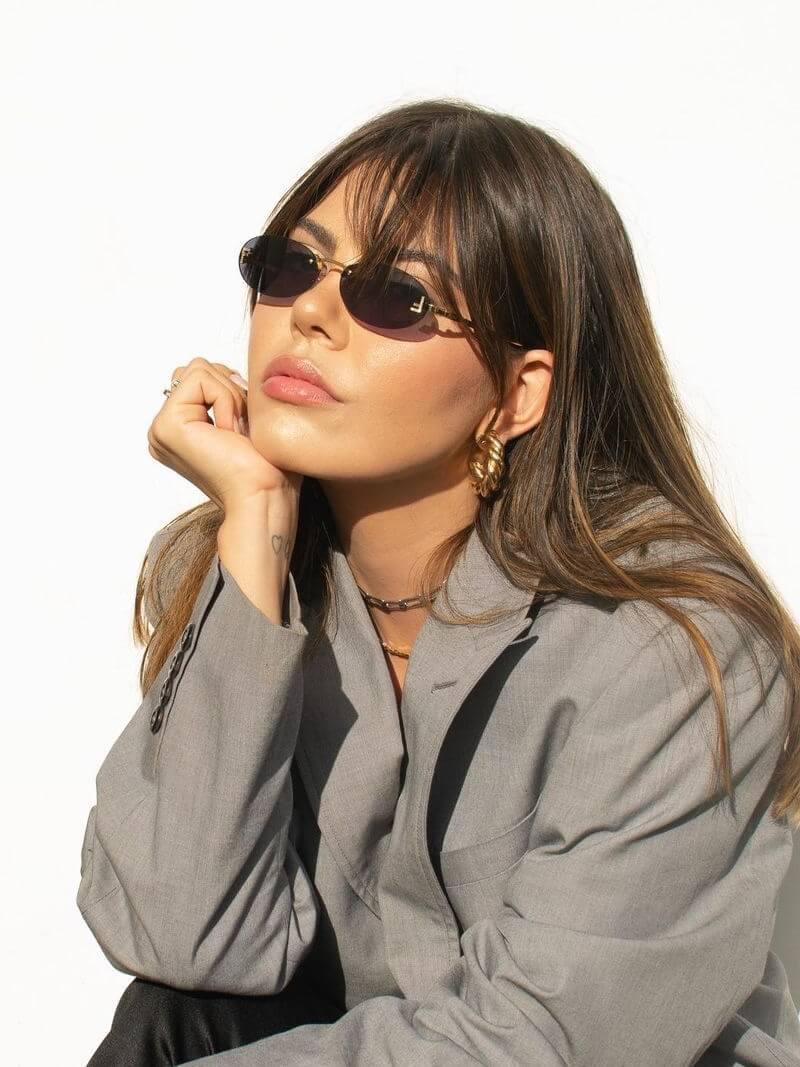 Oval Sunglasses With Golden Accents and Subtle Stones