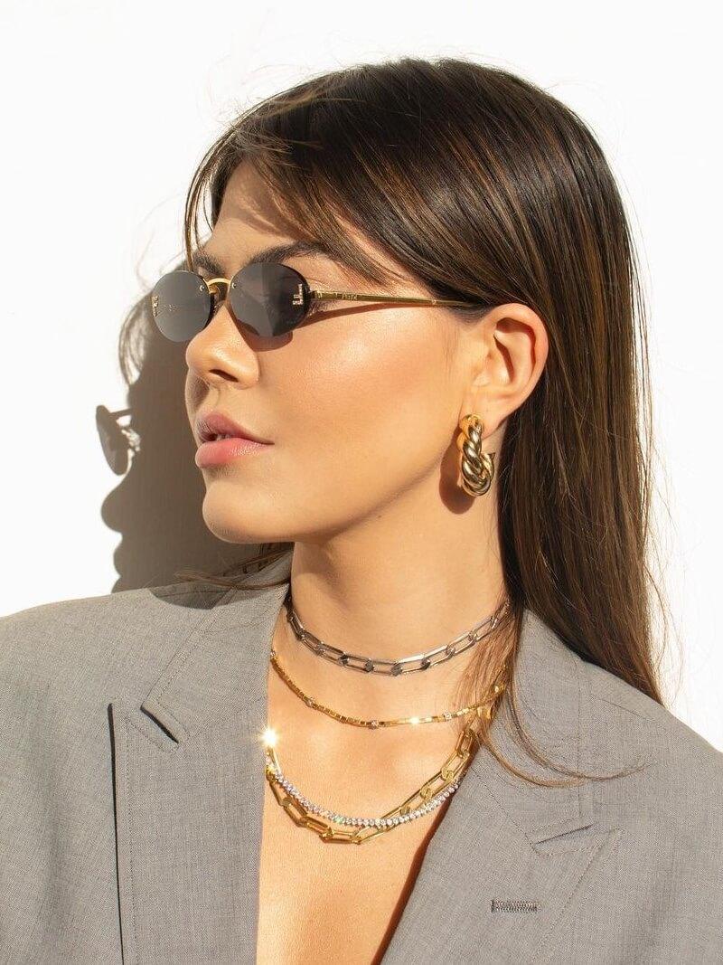 Oval Sunglasses With Golden Accents and Subtle Stones
