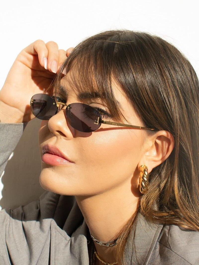 Oval Sunglasses With Golden Accents and Subtle Stones