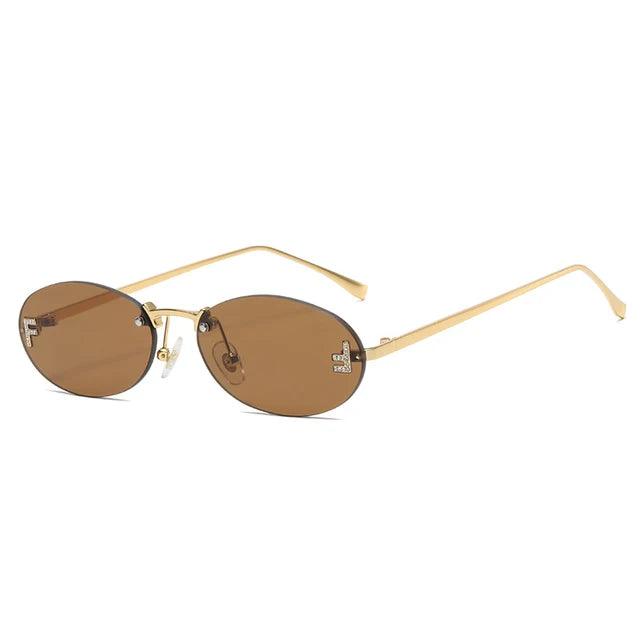 Oval Sunglasses With Golden Accents and Subtle Stones