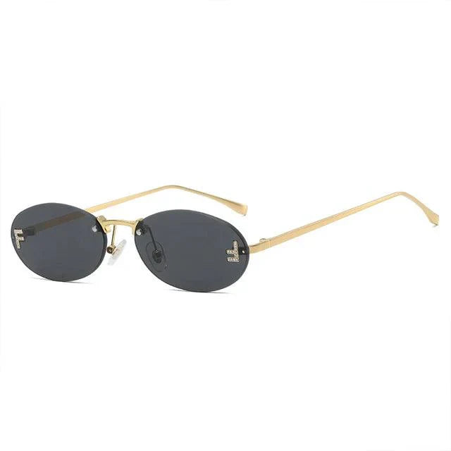 Oval Sunglasses With Golden Accents and Subtle Stones