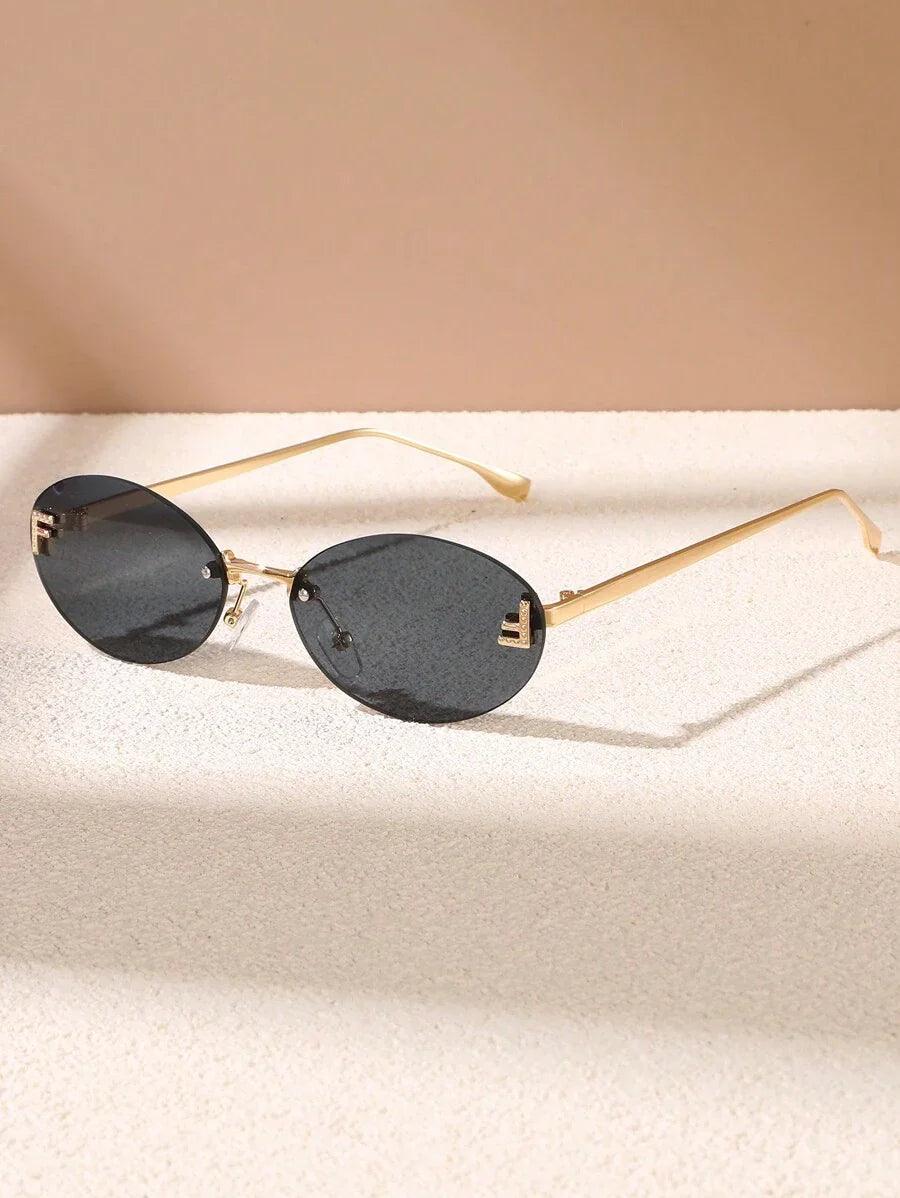 Oval Sunglasses With Golden Accents and Subtle Stones