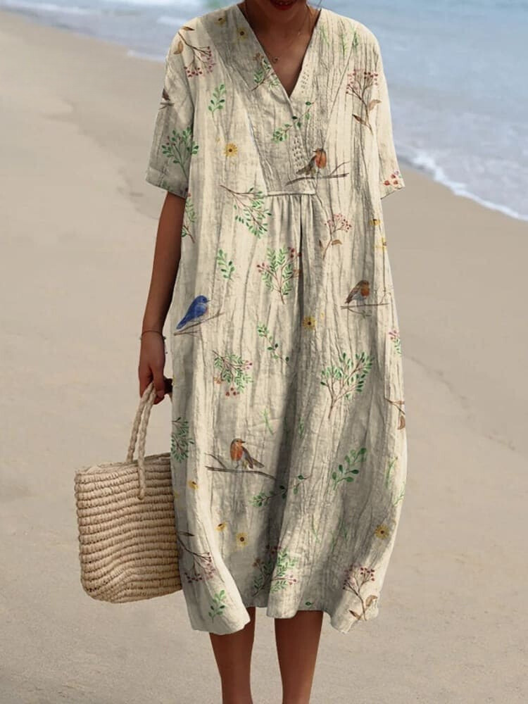 Casual women's blouse made of cotton and linen with bird and branch print and robin